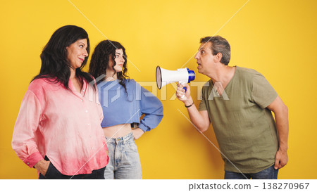 Family conflict with father yelling into megaphone Family conflict with father yelling into megaphone 138270967