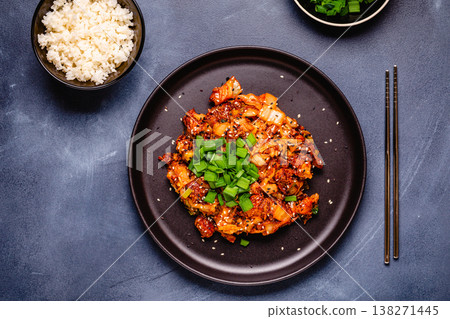Fried kimchi with pork onions and spices. Traditional Korean food Fried kimchi with pork onions and spices. Traditional Korean food 138271445