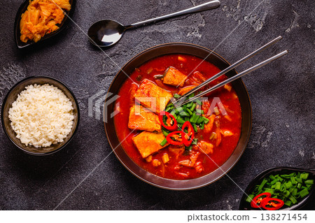Korean traditional food, spicy kimchi soup (kimchi tige) with pork and tofu cheese. Korean traditional food, spicy kimchi soup (kimchi tige) with pork and tofu cheese. 138271454