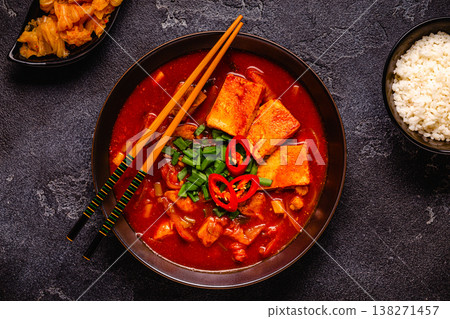 Korean traditional food, spicy kimchi soup (kimchi tige) with pork and tofu cheese. Korean traditional food, spicy kimchi soup (kimchi tige) with pork and tofu cheese. 138271457