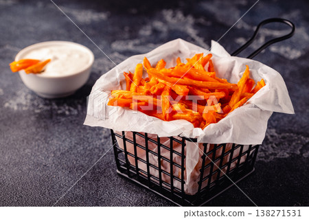 Sweet potato fries with blue cheese sauce. 138271531