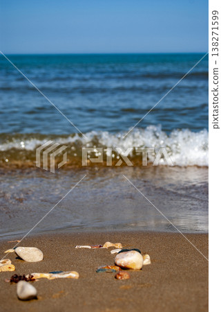 Ocean Waves Washing Over Pebbles on a Sandy Beach Ocean Waves Washing Over Pebbles on a Sandy Beach 138271599