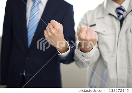 A young businessman who plays guts pose A young businessman who plays guts pose 138272545