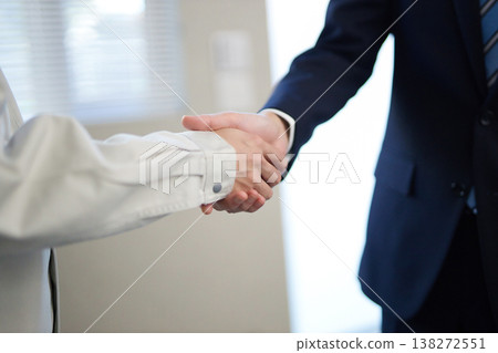 Young businessman shaking hands Young businessman shaking hands 138272551