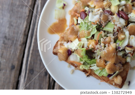 Toast topped with chopped salad served with miso dressing Toast topped with chopped salad served with miso dressing 138272949