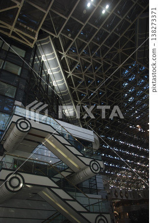 A massive, three-dimensional truss roof covering the atrium and futuristic escalators. A massive, three-dimensional truss roof covering the atrium and futuristic escalators. 138273371