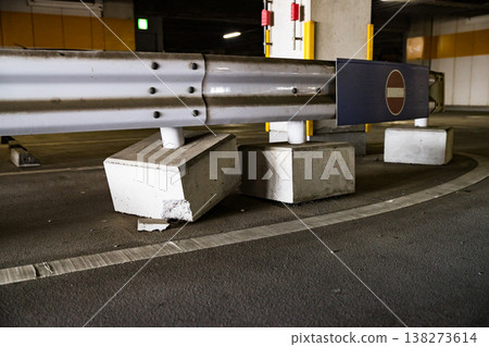 Damaged guardrail in a multi-story parking garage. 138273614