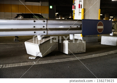 Damaged guardrail in a multi-story parking garage. 138273615