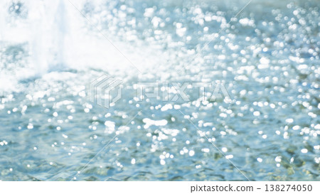 Sparkling water splashes and the water's surface Sparkling water splashes and the water's surface 138274050