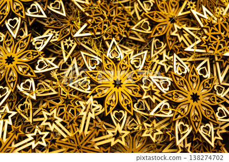 Eco-friendly Christmas decorations made of natural wood, wooden snowflake ornaments. Eco-friendly Christmas decorations made of natural wood, wooden snowflake ornaments. 138274702