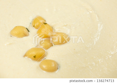 Macro texture of smooth creamy hummus top view Macro texture of smooth creamy hummus top view 138274713
