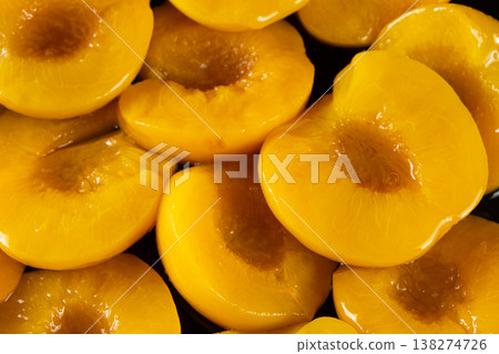 Group of preserved yellow peaches as a delicious food background. Group of preserved yellow peaches as a delicious food background. 138274726