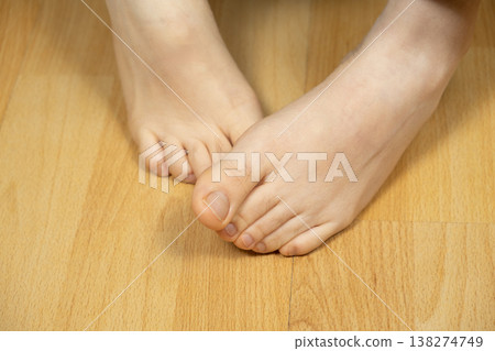 Close up of healthy bare feet showing natural toe spread. Close up of healthy bare feet showing natural toe spread. 138274749