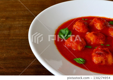 Tomato soup with meatballs in the background of the table Tomato soup with meatballs in the background of the table 138274954