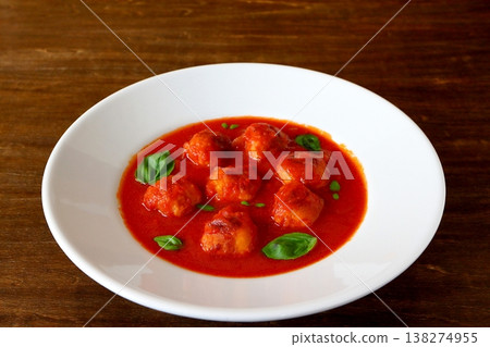 Tomato soup with meatballs in the background of the table Tomato soup with meatballs in the background of the table 138274955