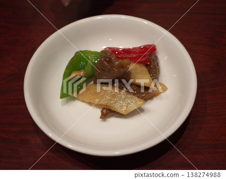 An overhead shot of sweet and sour pork served on a small white plate. An overhead shot of sweet and sour pork served on a small white plate. 138274988