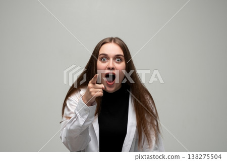 Woman feeling shocked and surprised, pointing finger, accusing or blaming, expressing disbelief and anger Woman feeling shocked and surprised, pointing finger, accusing or blaming, expressing disbelief and anger 138275504