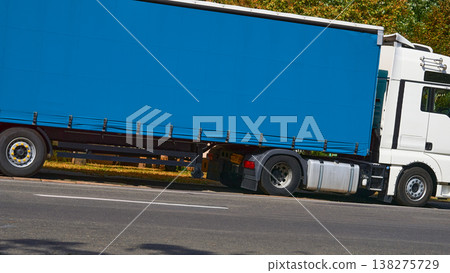 Delivering. Big blue trailer for long distance transportation Delivering. Big blue trailer for long distance transportation 138275729
