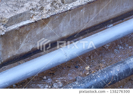 Excavated pit with plastic plumbing sewage pipes for repair and installation Excavated pit with plastic plumbing sewage pipes for repair and installation 138276300