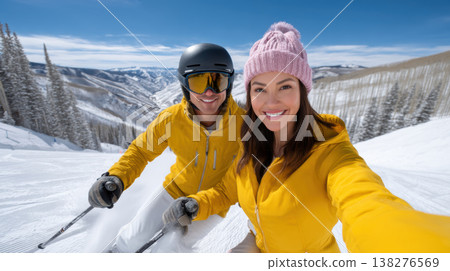 Happy couple skiing wear yellow jacket taking selfie on winter mountain 138276569