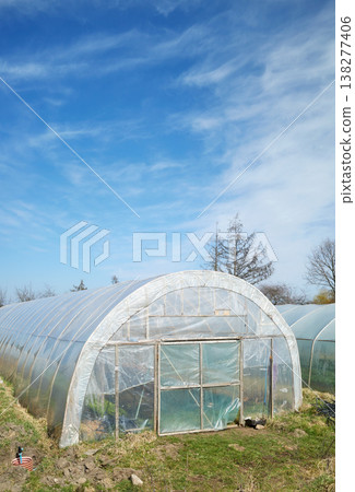 Greenhouses on an organic vegetable farm. 138277406