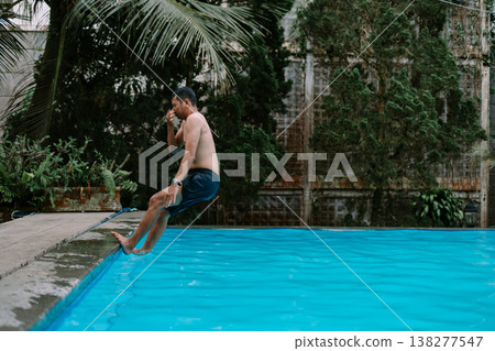Southeast Asian man enjoying outdoor swimming Southeast Asian man enjoying outdoor swimming 138277547