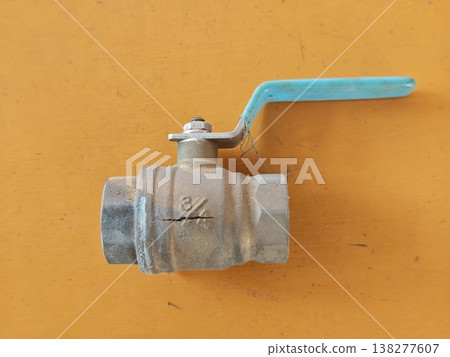 Photos of cracked brass ball valves and frost damage to agricultural equipment. 138277607