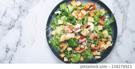 Caesar salad, with shrimp, on a marble background, top view, no people, Caesar salad, with shrimp, on a marble background, top view, no people, 138278923
