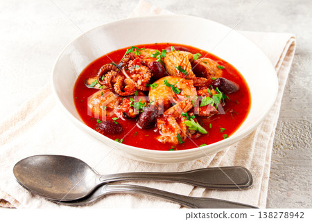 seafood assortment in tomato sauce, olives, in a white plate, seafood assortment in tomato sauce, olives, in a white plate, 138278942