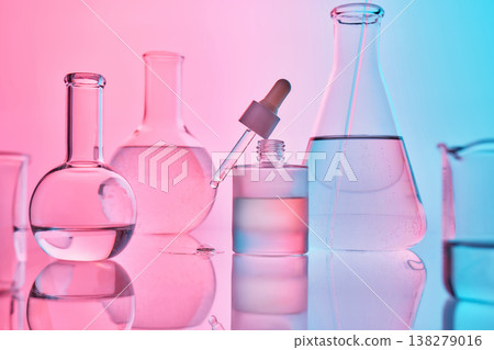 Science laboratory glassware experimenting with a dropper and liquid Science laboratory glassware experimenting with a dropper and liquid 138279016