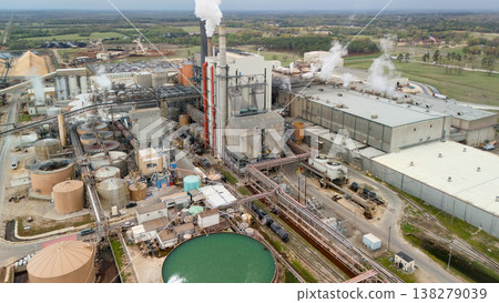 Aerial view of industrial plant with smokestack tanks and basin Aerial view of industrial plant with smokestack tanks and basin 138279039