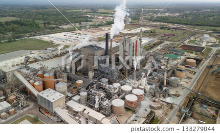 Aerial view of industrial plant with smokestacks tanks and factory complex 138279044