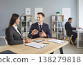 Man and woman are meeting in office and discussing business and financial matters 138279818