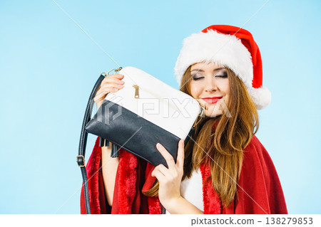 Christmas girl holding handbag present Christmas girl holding handbag present 138279853