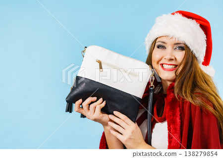 Christmas happy girl holding handbag present Christmas happy girl holding handbag present 138279854
