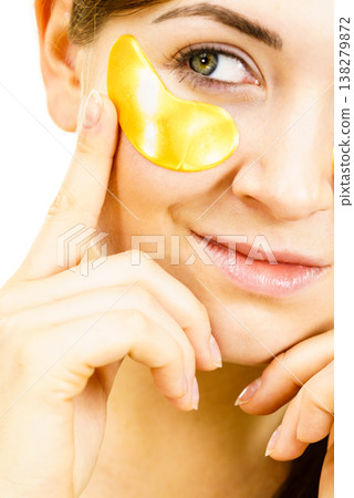 Woman with gold patches under eyes Woman with gold patches under eyes 138279872