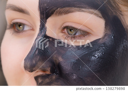 Woman with charcoal facial mask Woman with charcoal facial mask 138279898
