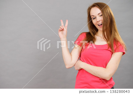 Woman making victory sign Woman making victory sign 138280043
