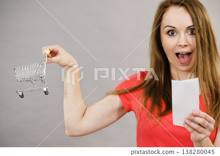 Woman with shopping list and cart Woman with shopping list and cart 138280045