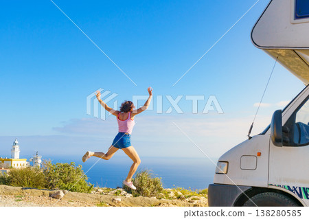 Woman enjoy trip with motorhome Woman enjoy trip with motorhome 138280585