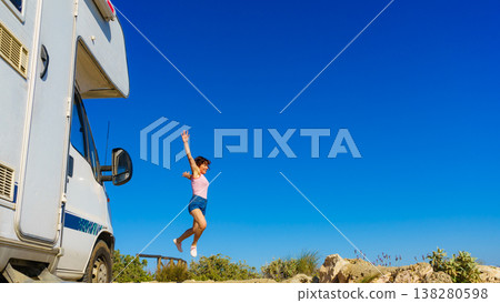 Woman enjoy trip with motorhome Woman enjoy trip with motorhome 138280598