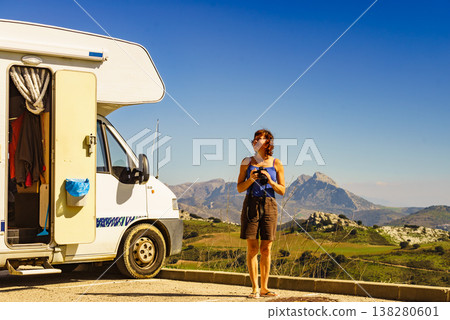 Woman travel with caravan, taking photo Woman travel with caravan, taking photo 138280601