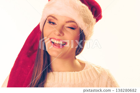 Woman in santa hat 138280682