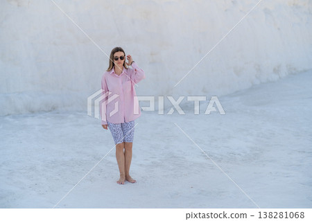 Exploring the Unique Terraces of Pamukkale Under Clear Skies During a Warm Day, Capturing the Beauty of Nature and Leisure 138281068