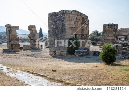 Exploring the Ancient Ruins in Pamukkale, Turkey Surrounded by Natural Beauty and Historical Structures During a Clear Day 138281114