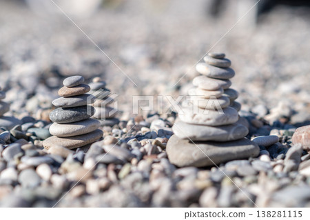 Stacked Stones on a Pebbled Beach Showcase Creative Arrangement and Balance Under Natural Sunlight in a Tranquil Outdoor Setting Stacked Stones on a Pebbled Beach Showcase Creative Arrangement and Balance Under Natural Sunlight in a Tranquil Outdoor Setting 138281115