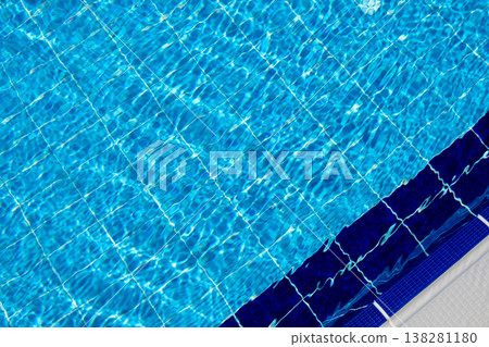 Clear Blue Swimming Pool Water With Grid Pattern and Edge Design on a Sunny Day in a Residential Area 138281180