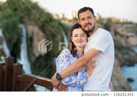 Couple Enjoying a Romantic Moment Near the Waterfall in Antalya, Turkey During Sunset Couple Enjoying a Romantic Moment Near the Waterfall in Antalya, Turkey During Sunset 138281301