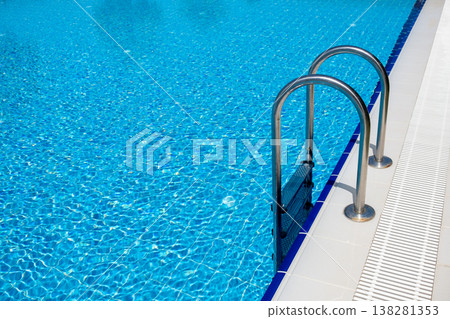 Sparkling Blue Swimming Pool With Metal Ladder on a Sunny Day Inviting Relaxation and Enjoyment 138281353