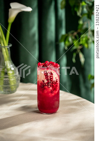 Pomegranate cocktail with ice and fresh seeds Pomegranate cocktail with ice and fresh seeds 138282421